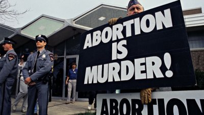 Anti-Abortion Supporter Demonstrating Outside Abortion Clinic